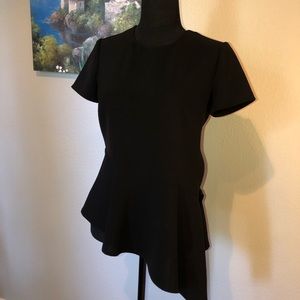 Elegant black top. Side zipper for formfitting.